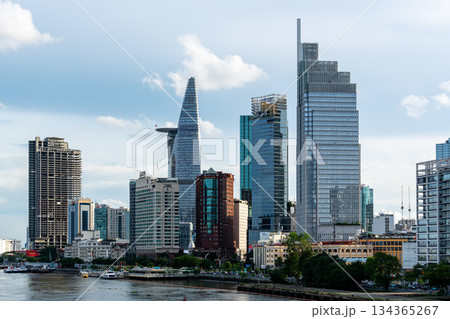 Ho Chi Minh City, Vietnam June 23, 2025: district 1, view to Bitexco Financial Tower with Vietnam flag on the top building. One of the famous buildings in ho chi minh city view point. 134365267