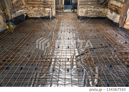 Reinforced Concrete Slab Preparation with Rebar Grid for Durable Construction Project Reinforced Concrete Slab Preparation with Rebar Grid for Durable Construction Project 134367593