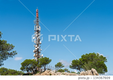 Telecommunications Tower on a Sunny Day, Symbolizing Modern Communication and Connectivity. Telecommunications Tower on a Sunny Day, Symbolizing Modern Communication and Connectivity. 134367609