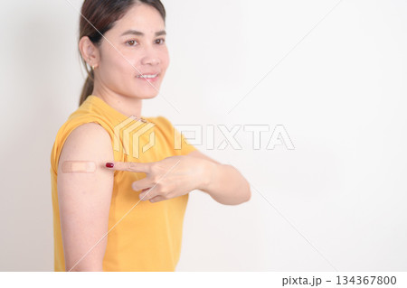 Adult Woman with bandage after received vaccine. Vaccination and Immunization for Influenza, HPV, Zoster, IPD, DTP or Diphtheria, Tetanus and Pertussis, MMR, Hepatitis B, Covid and Varicella vaccine Adult Woman with bandage after received vaccine. Vaccination and Immunization for Influenza, HPV, Zoster, IPD, DTP or Diphtheria, Tetanus and Pertussis, MMR, Hepatitis B, Covid and Varicella vaccine 134367800