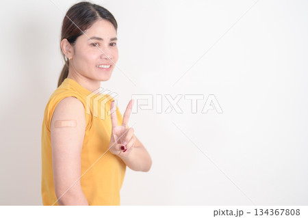 Adult Woman with bandage after received vaccine. Vaccination and Immunization for Influenza, HPV, Zoster, IPD, DTP or Diphtheria, Tetanus and Pertussis, MMR, Hepatitis B, Covid and Varicella vaccine 134367808