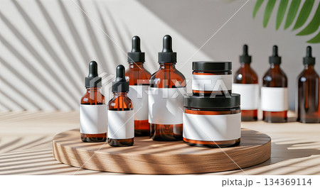 Cosmetic bottle mockup group on wooden podium with palm shadow and blurred bottles background amber glass skincare product packaging display Cosmetic bottle mockup group on wooden podium with palm shadow and blurred bottles background amber glass skincare product packaging display 134369114