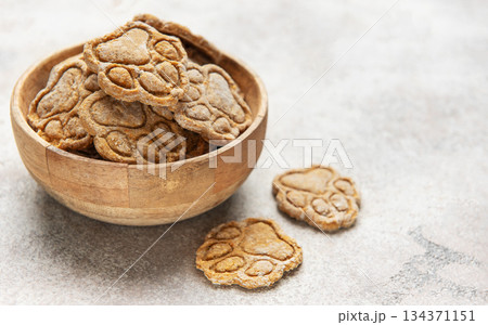 Homemade dog treats in paw print shape Homemade dog treats in paw print shape 134371151