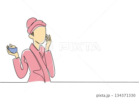 Single continuous line drawing a woman wearing a towel robe doing facial treatment. Apply night cream before bed. Regenerates skin. National Skincare Education Day. One line design vector illustration 134371330