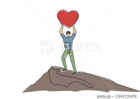 A single line drawing of a young man lifting a heart high while standing on a winding mountain path, representing victorious love for Love Conquers All Day in a relationship and achievement concept. A single line drawing of a young man lifting a heart high while standing on a winding mountain path, representing victorious love for Love Conquers All Day in a relationship and achievement concept. 134372470