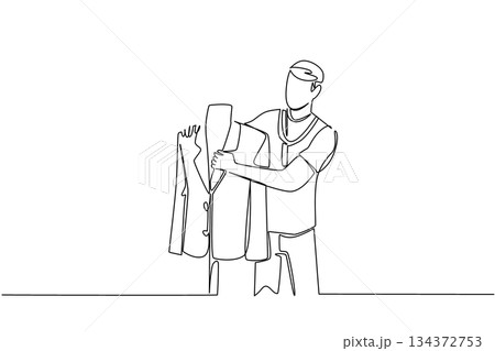 Single line drawing depicts a male tailor examining a suit jacket on a mannequin, representing tailoring industry concept for National Tailors Day, honoring craftsmanship, design, and bespoke app Single line drawing depicts a male tailor examining a suit jacket on a mannequin, representing tailoring industry concept for National Tailors Day, honoring craftsmanship, design, and bespoke app 134372753