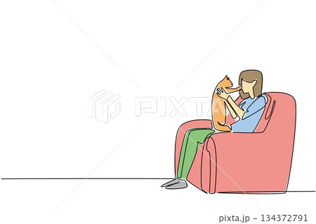 Celebrate National Hug Your Cat Day with this continuous line drawing artwork featuring a woman sitting on a sofa hugging her cat, symbolizing love, comfort, and the pet care concept. 134372791