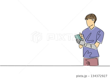 Single line drawing of a young man using a smartphone with a prosthetic arm, symbolizing modern assistive technology in everyday life, health concept, World Day for Assistive Technology. 134372927