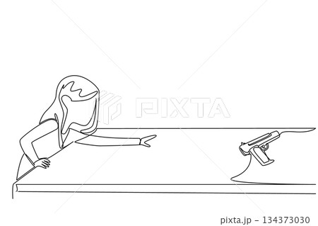 A young girl reaching for a gun placed on a table is shown in continuous line drawing style. This safety concept illustrates the dangers of unsafe storage, reflecting National SAFE Day awareness. 134373030