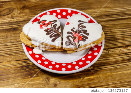 Heart shaped cookies on wooden table. Dessert for Valentine day Heart shaped cookies on wooden table. Dessert for Valentine day 134373127