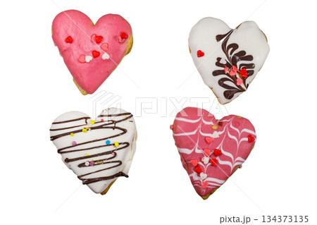Four heart shaped cookies isolated on white background Four heart shaped cookies isolated on white background 134373135