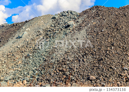 View of slag heaps of iron ore quarry. Mining industry 134373138