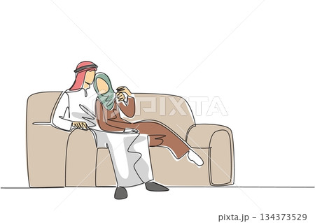 Continuous line drawing of an Arab couple lounging comfortably on large armchair, with woman resting on man, symbolizing cultural relaxation, closeness, and shared moments. National Loving Day Continuous line drawing of an Arab couple lounging comfortably on large armchair, with woman resting on man, symbolizing cultural relaxation, closeness, and shared moments. National Loving Day 134373529