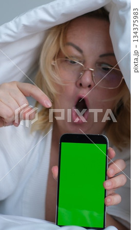 green screen for chroma key advertising Shocked lady staring at smartphone with open mouth. Middle-aged woman reading surprising message on phone, amazing news at night green screen for chroma key advertising Shocked lady staring at smartphone with open mouth. Middle-aged woman reading surprising message on phone, amazing news at night 134375983