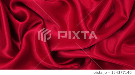 Smooth elegant red silk or satin luxury cloth texture as abstract background. Luxurious valentines day background design 134377140