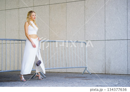 Woman wearing crop top and culottes Woman wearing crop top and culottes 134377636