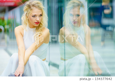 Fashionable woman in city 134377642