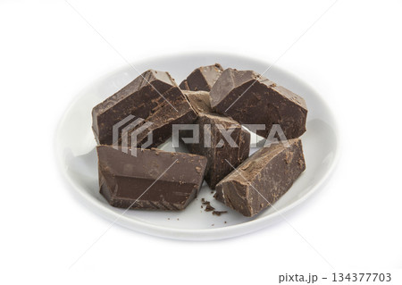 Dark chocolate in a white plate 134377703