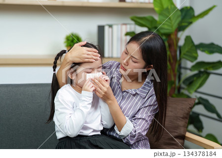 Mother Checking Temperature of Sick Daughter Mother Checking Temperature of Sick Daughter 134378184