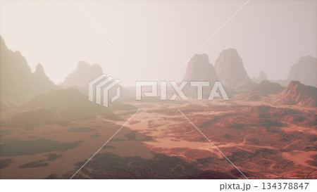 Breathtaking desert scene showcasing rugged mountains and arid terrain. The soft light casts a warm glow, creating an ethereal atmosphere as day transitions to night. Breathtaking desert scene showcasing rugged mountains and arid terrain. The soft light casts a warm glow, creating an ethereal atmosphere as day transitions to night. 134378847