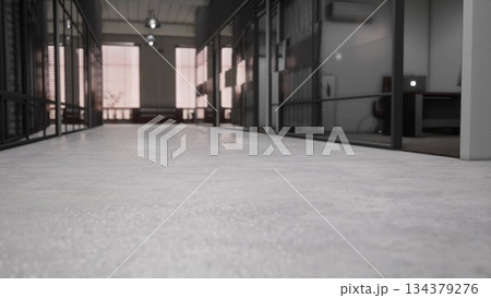 A sleek hallway connects various offices, showcasing large glass walls and polished concrete floors. Soft natural light filters in, enhancing the contemporary workspace feel. A sleek hallway connects various offices, showcasing large glass walls and polished concrete floors. Soft natural light filters in, enhancing the contemporary workspace feel. 134379276
