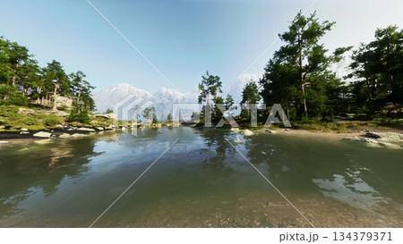 Clear waters of a peaceful lake mirror the surrounding pine trees and stunning mountains under a bright blue sky. The scene evokes calmness and the beauty of the great outdoors. 134379371