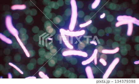 In a dark setting, colorful microscopic organisms are swimming and swirling around, creating a mesmerizing visual spectacle. Their movement brings life to the dark background. 134379398