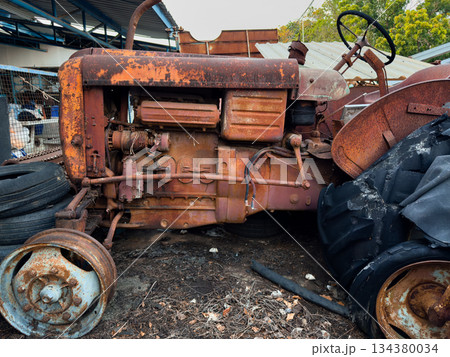 Old rusty vehicles in a vintage industrial setting Old rusty vehicles in a vintage industrial setting 134380034