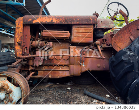 Old rusty vehicles in a vintage industrial setting Old rusty vehicles in a vintage industrial setting 134380035