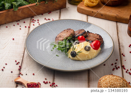 Grilled beef medallions with mashed potatoes 134380193