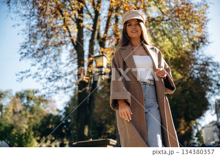 Having a walk. Beautiful woman is outdoors in the town 134380357