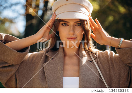 Beautiful woman is outdoors in the town 134380358