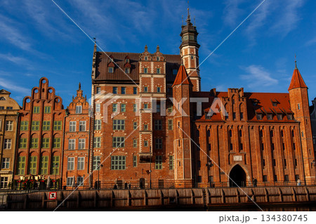 Historic buildings line Gdansk's canal at sunset Historic buildings line Gdansk's canal at sunset 134380745