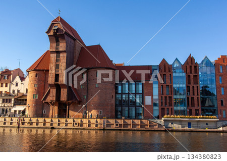 Historic buildings along the river in Gdansk with clear blue sky Historic buildings along the river in Gdansk with clear blue sky 134380823