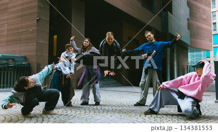 Breakdance group practicing expressive movement in modern city Breakdance group practicing expressive movement in modern city 134381553