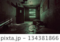 A dimly lit corridor shows an unsettling scene filled with scattered papers on the floor. Green light filters through the window, adding an eerie vibe to the abandoned space. 134381866