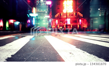 Vibrant city streets come alive at night, showcasing colorful neon lights from nearby buildings. The wet pavement reflects the brightness, inviting night owls and explorers. Vibrant city streets come alive at night, showcasing colorful neon lights from nearby buildings. The wet pavement reflects the brightness, inviting night owls and explorers. 134381870