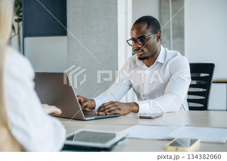 Two business people are working together in the office Two business people are working together in the office 134382060