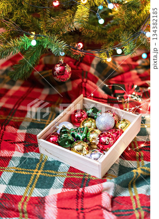 Decorations for Christmas Tree , silver and red Balls Garlands Lights on red green Background Holidays Home Decor toy Decorations for Christmas Tree , silver and red Balls Garlands Lights on red green Background Holidays Home Decor toy 134382185