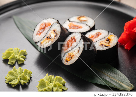 Yin yang sushi rolls with eel and salmon 134382370