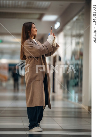Beautiful woman is in the mall, conception of shopping Beautiful woman is in the mall, conception of shopping 134383031
