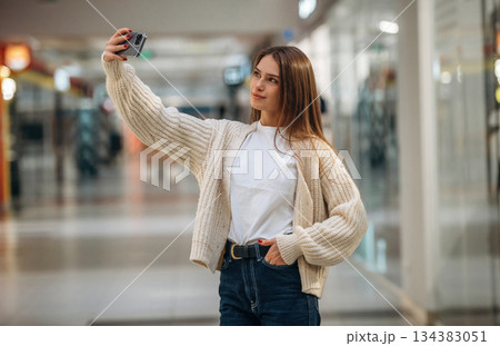 Making a selfie. Beautiful woman is in the mall, conception of shopping Making a selfie. Beautiful woman is in the mall, conception of shopping 134383051