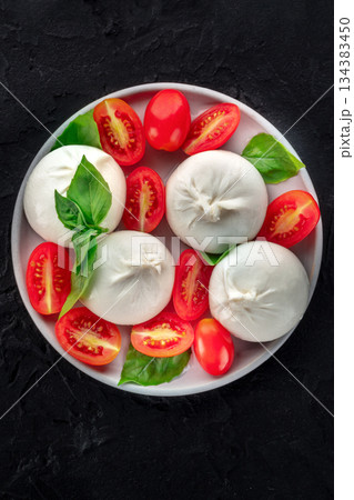 Buffalo Mozzarella, fresh cherry tomatoes, and basil leaves, Caprese salad Buffalo Mozzarella, fresh cherry tomatoes, and basil leaves, Caprese salad 134383450