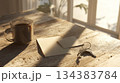 Cozy Morning Light: Coffee, Keys, and Notes on Wooden Table 134383784
