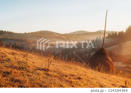 Hay is on the field. Majestic view of Carpathian mountains, autumn season Hay is on the field. Majestic view of Carpathian mountains, autumn season 134384364