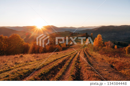Sun is over horizon. Majestic view of Carpathian mountains, autumn season Sun is over horizon. Majestic view of Carpathian mountains, autumn season 134384448