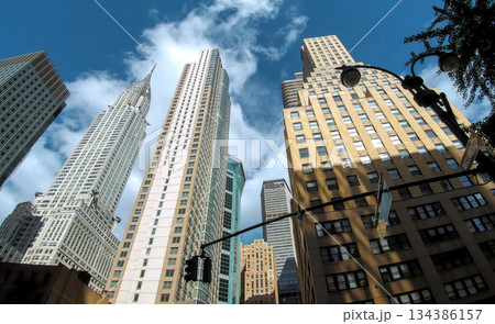 Tall buildings in New York City scene with clouds in Manhattan buildings background 134386157