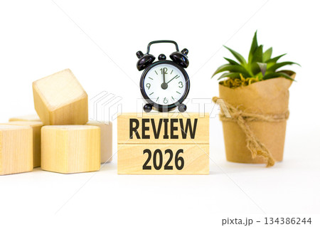 Review 2026 symbol. Concept words Review 2026 on beautiful wooden blocks. Beautiful white paper background. Beautiful black alarm clock. Business and review 2026 concept. Copy space. Review 2026 symbol. Concept words Review 2026 on beautiful wooden blocks. Beautiful white paper background. Beautiful black alarm clock. Business and review 2026 concept. Copy space. 134386244