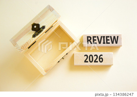 Review 2026 symbol. Concept words Review 2026 on beautiful wooden blocks. Beautiful white paper background. Beautiful empty wooden chest. Business and review 2026 concept. Copy space. 134386247