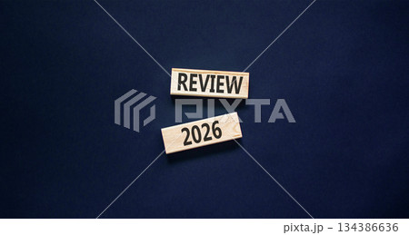 Review 2026 symbol. Concept words Review 2026 on beautiful wooden blocks. Beautiful black paper background. Business and review 2026 concept. Copy space. 134386636